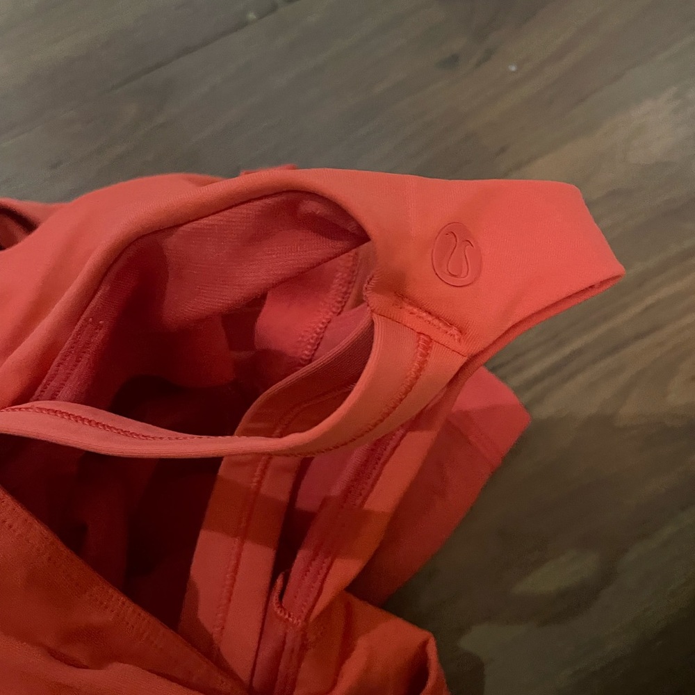 Never worn like new Lululemon top. Fits more like a size 2 for an xs.